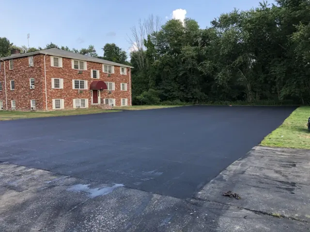 Newly paved apartment parking lot in Salem, NH by Young's Excavating & Paving LLC