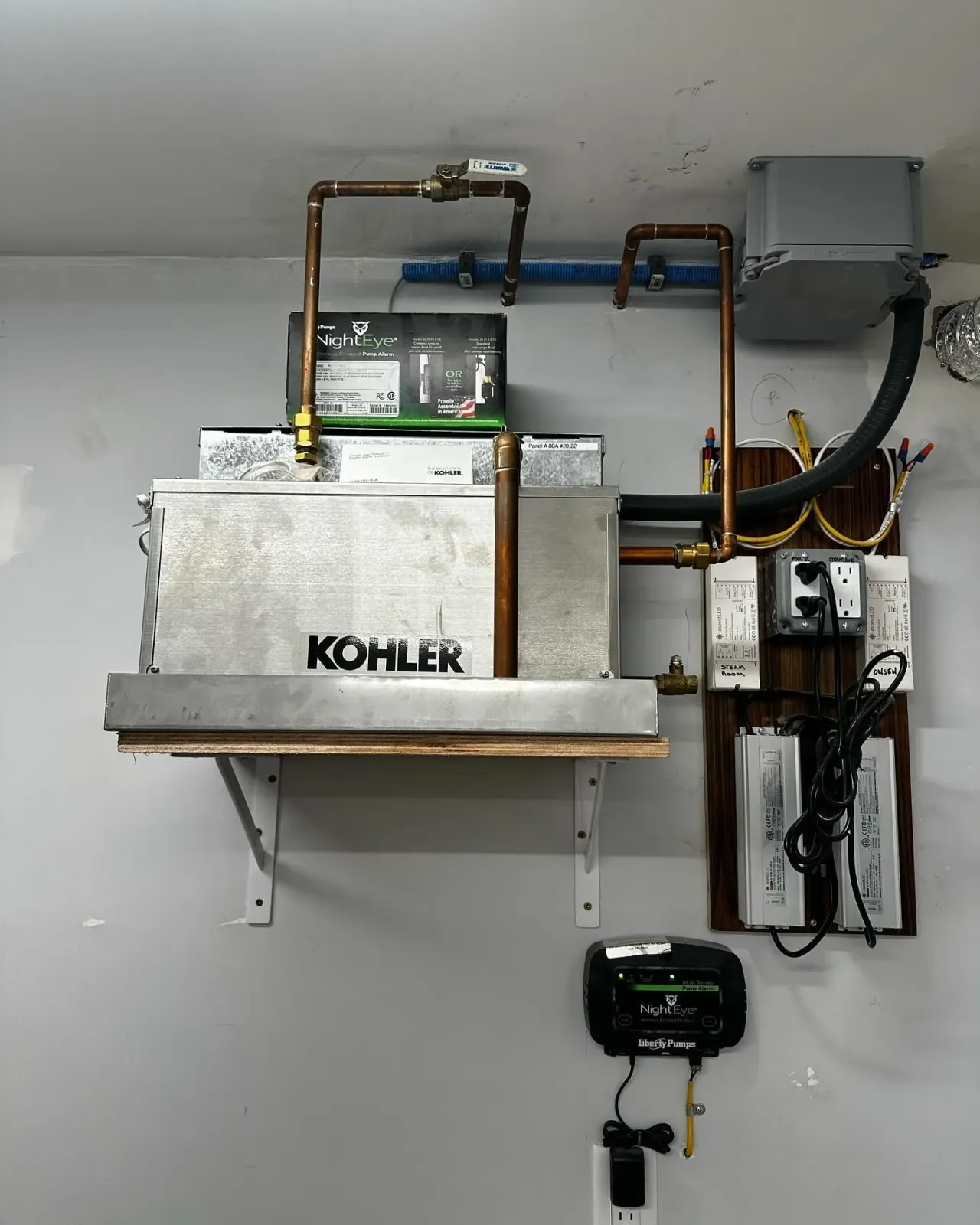 a Köhler water heater is mounted to a wall