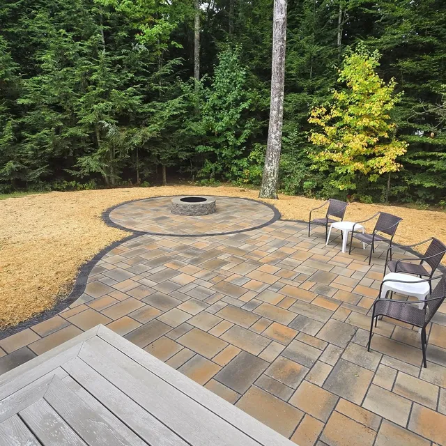 Super cool design that our clients had already purchased from a local designer. We suggested materials and executed the installation. 

Techo block blue 60 champlain grey with valencia fire pit kit.