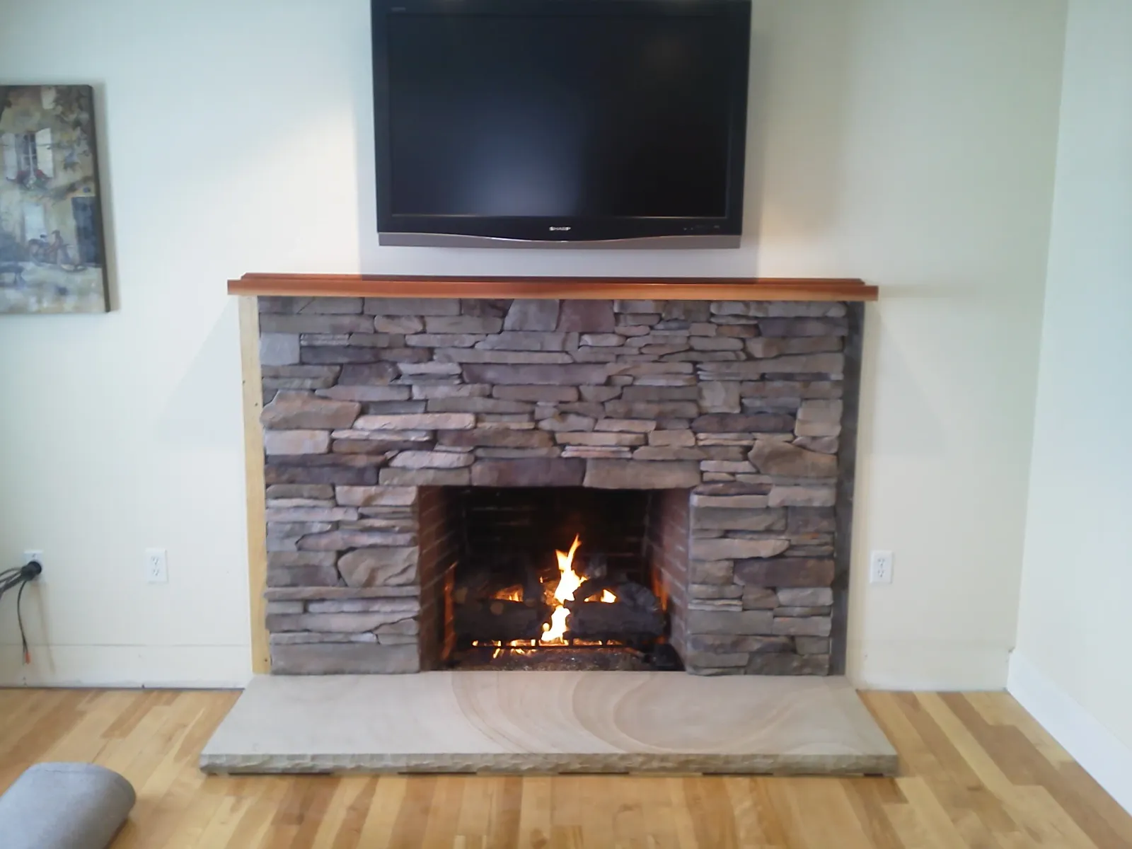 Custom ledge stone veneer with New Hampshire granite hearth - NH Chimney Sweep