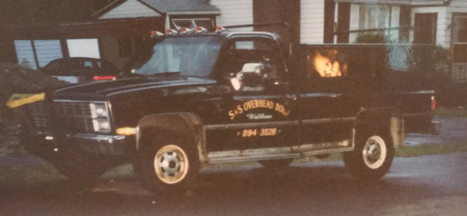 S&S Overhead Door Waltham, MA black vintage company truck.