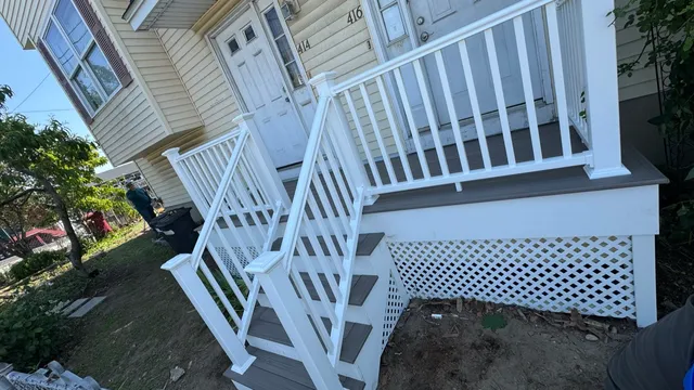 Porch with new white railings and lattice skirting