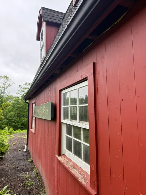 Exterior red barn siding pest inspection