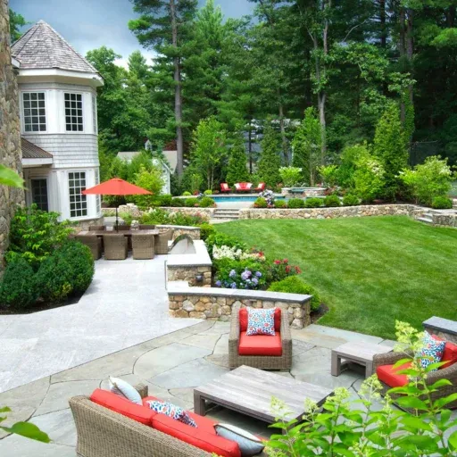 This Wellesley tennis court landscape integrates athletic function, crisp planting, and estate-level landscape design within a refined residential setting.