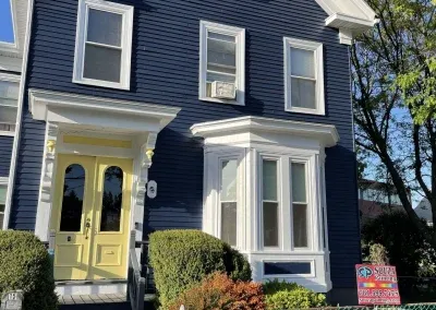 blue with yellow door exterior house painting job