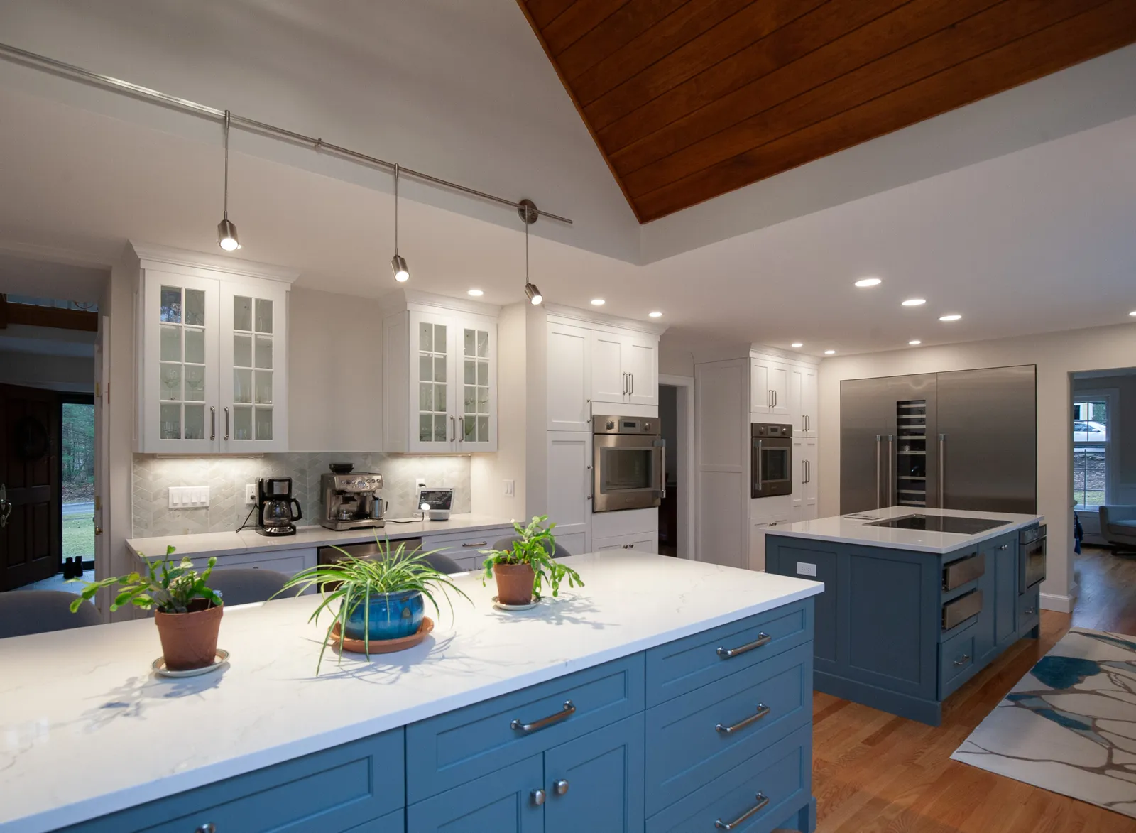 Blue island kitchen with glass upper cabinets