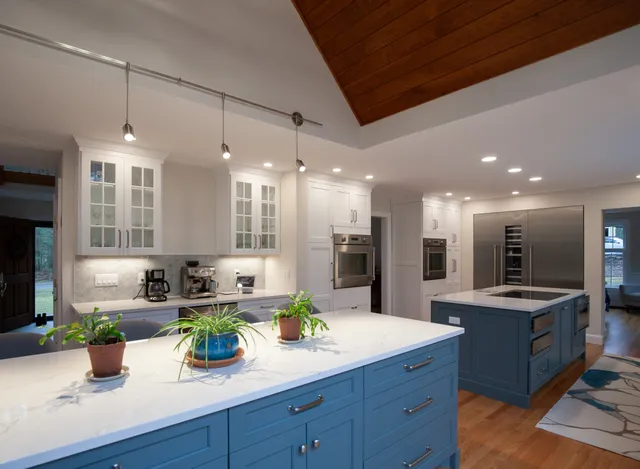 Blue island kitchen with glass upper cabinets