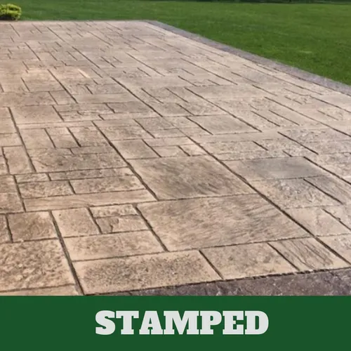 Concrete driveway with a dark gray color additive and concrete sealer.