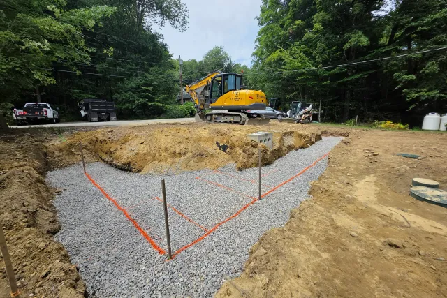 Gravel base and layout markings during wall construction