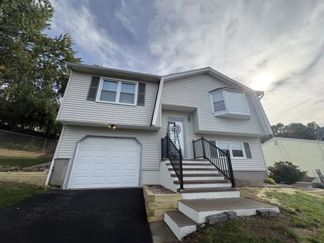 Front of the home after painting the siding, trim and shutters