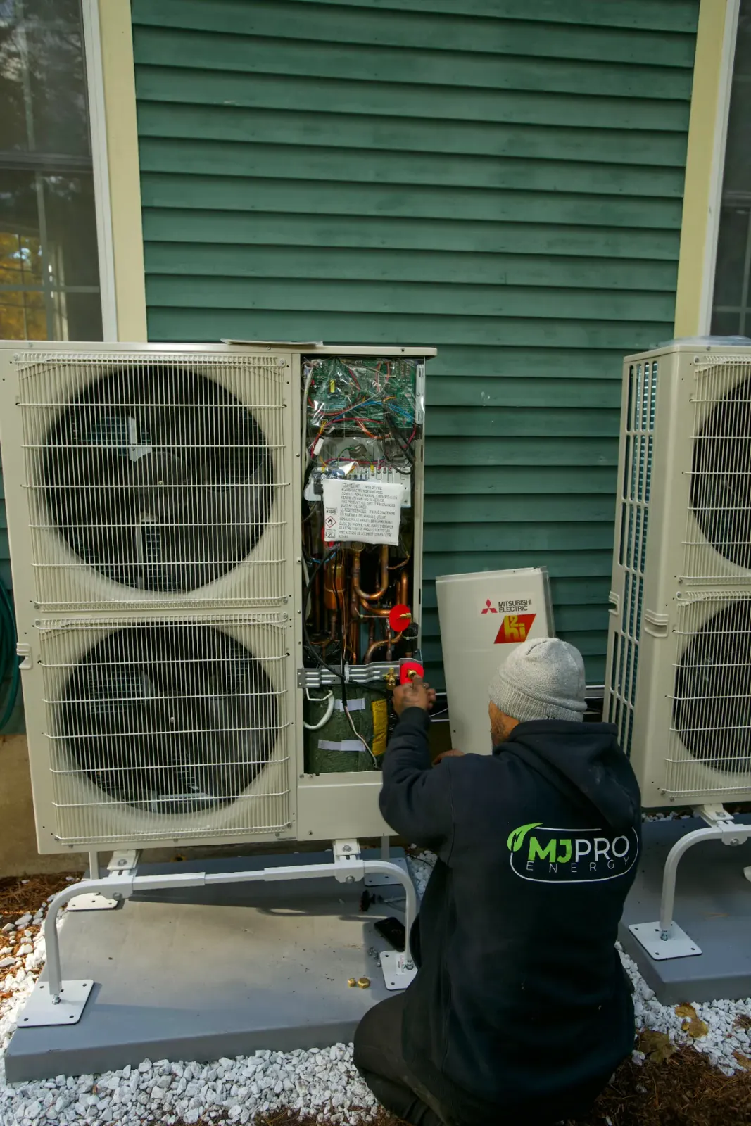 Technician repairing an air conditioner