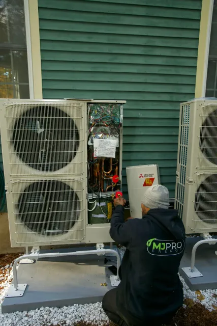 Technician repairing an air conditioner