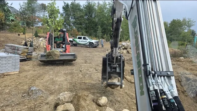Globe Green crew, excavator and truck on a large landscaping job near Concord, NH