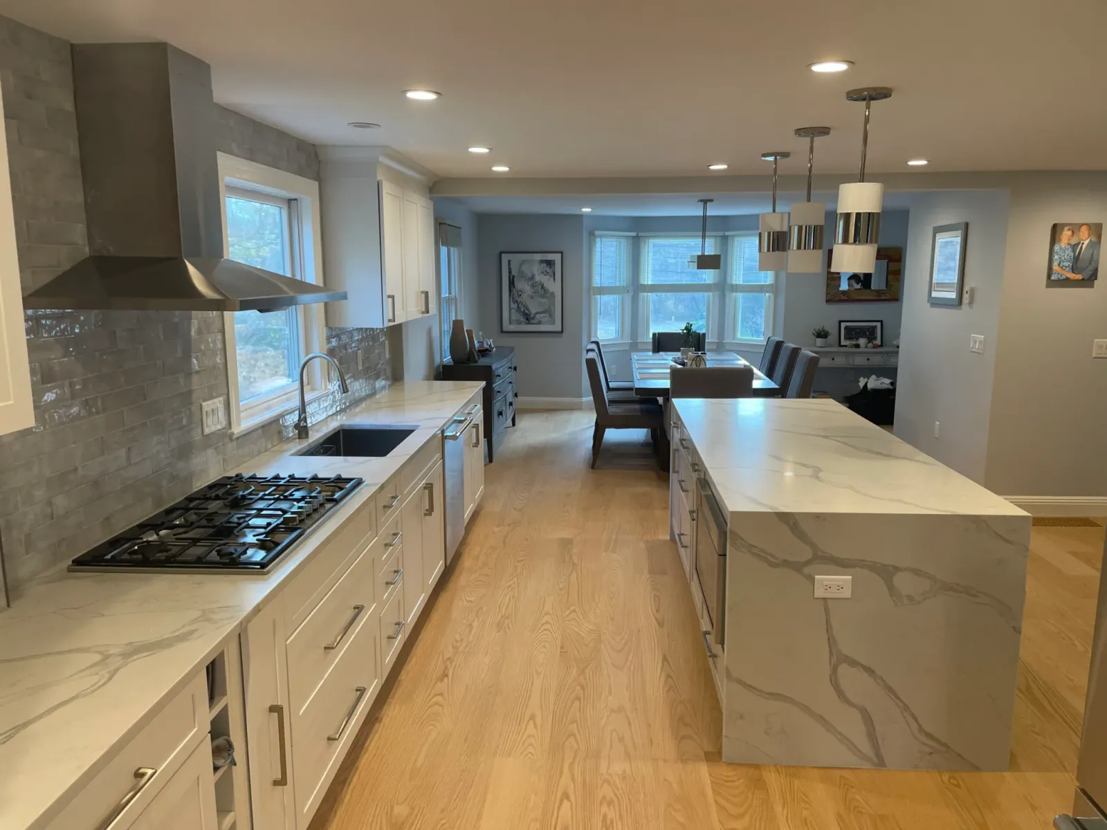 Kitchen remodeling project completed near Waltham, MA featuring custom cabinetry and quartz countertops