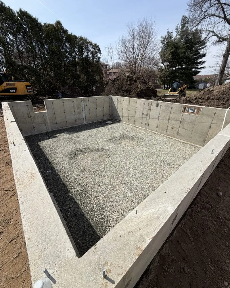 Foundation excavation for residential ADU construction basement floor prep