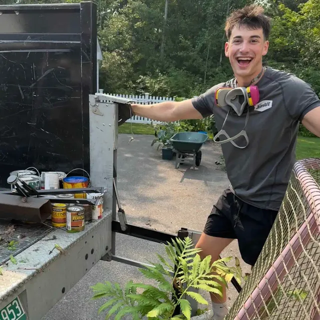 Junkit team member smiling on-site during a job