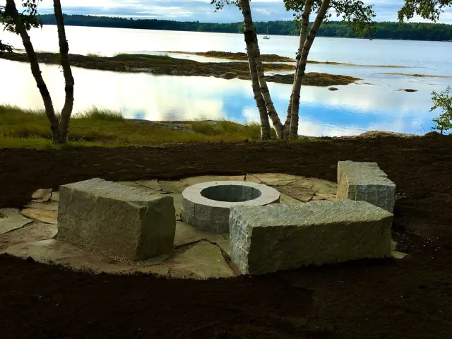 Custom hand cut granite stone fireplace, patio and benches