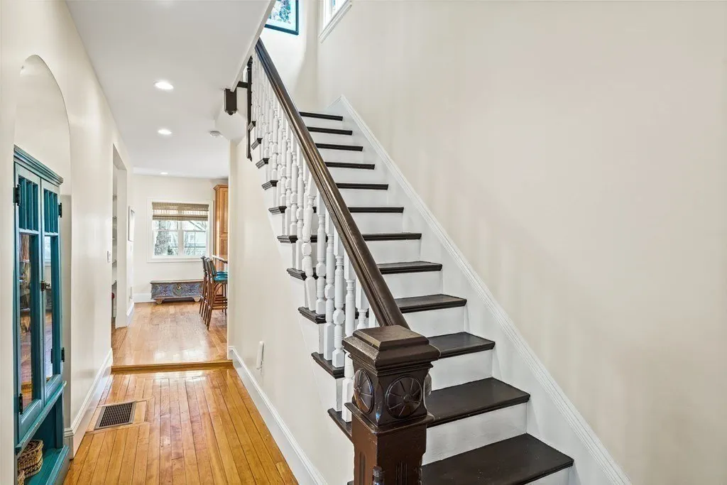 Custom stair millwork and newel post detail by Ferragamo Custom Builders in Melrose, MA