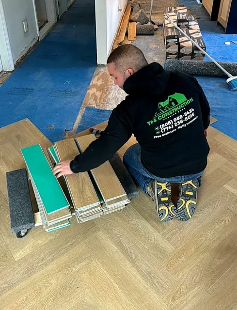 Josh installing laminate herringbone flooring