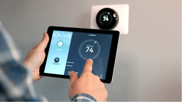 Man adjusting his thermostat on his tablet