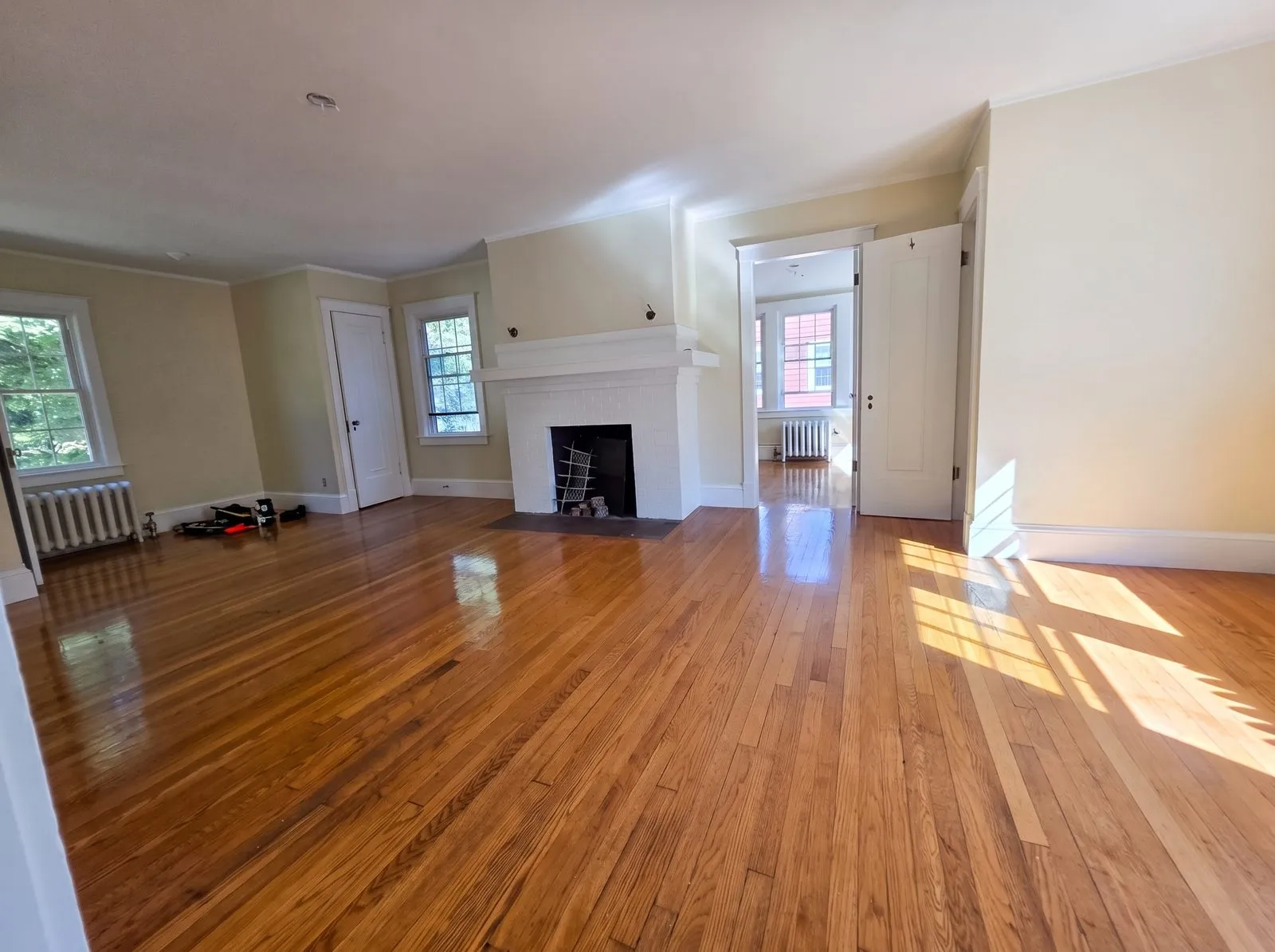 Living room finished — hardwood and fireplace