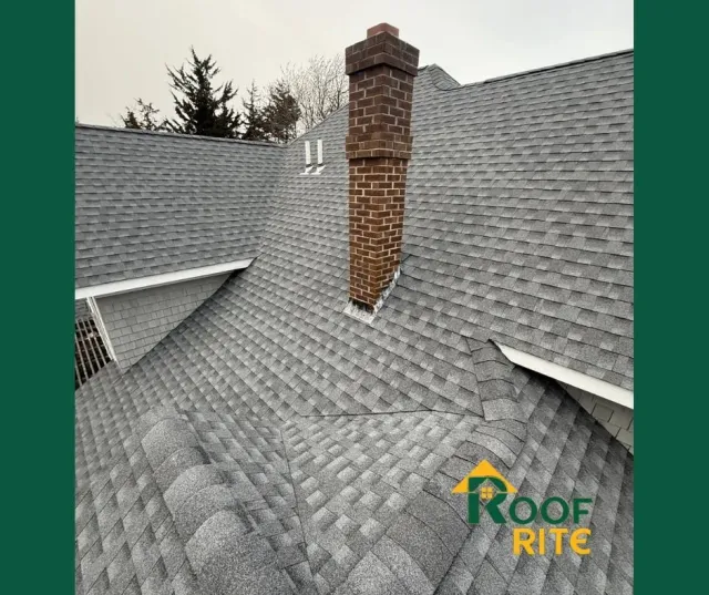 Gray shingle roof with brick chimney, the