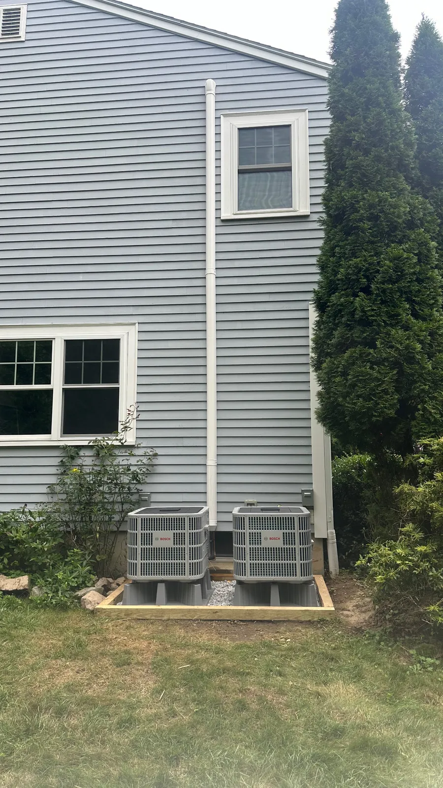 Two Bosch central air conditioning condensers installed by EML Mechanical