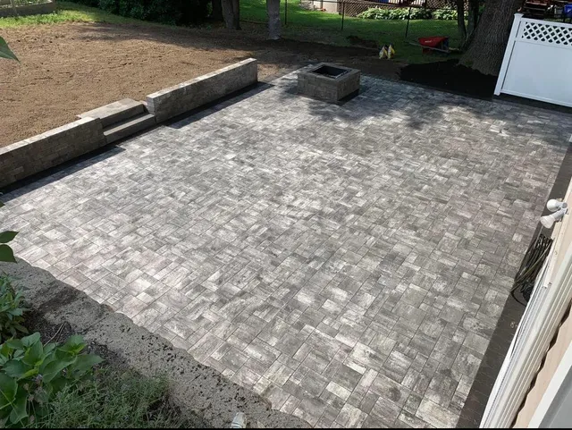 Custom paver patio installation by Cote Landscape in Northern Rhode Island