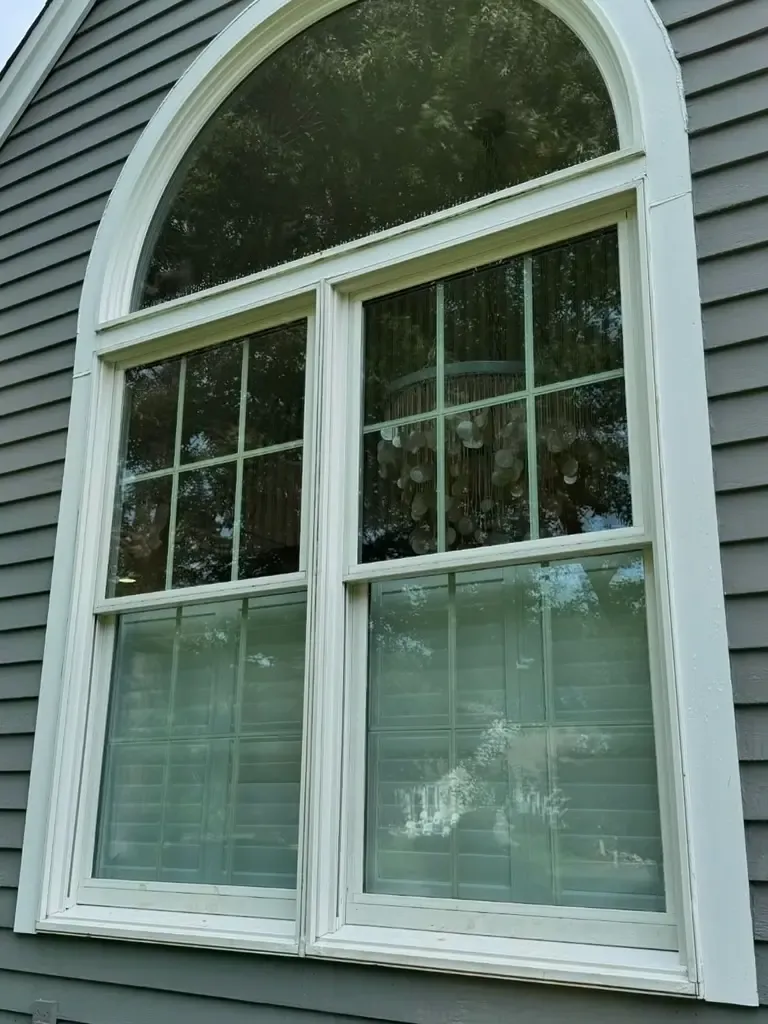 Photo of a squeaky clean french arched style window
