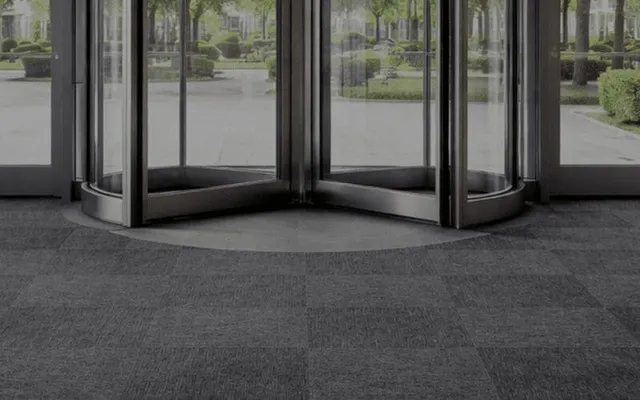 Revolving glass entrance door with outdoor view