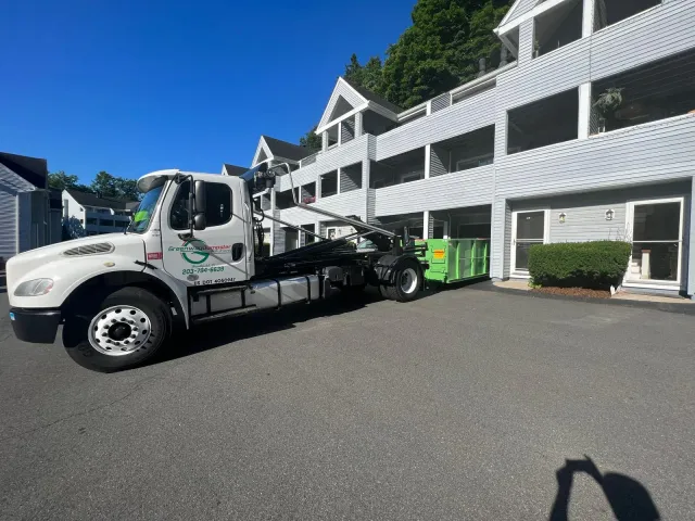 Full truck and dumpster at commercial property
