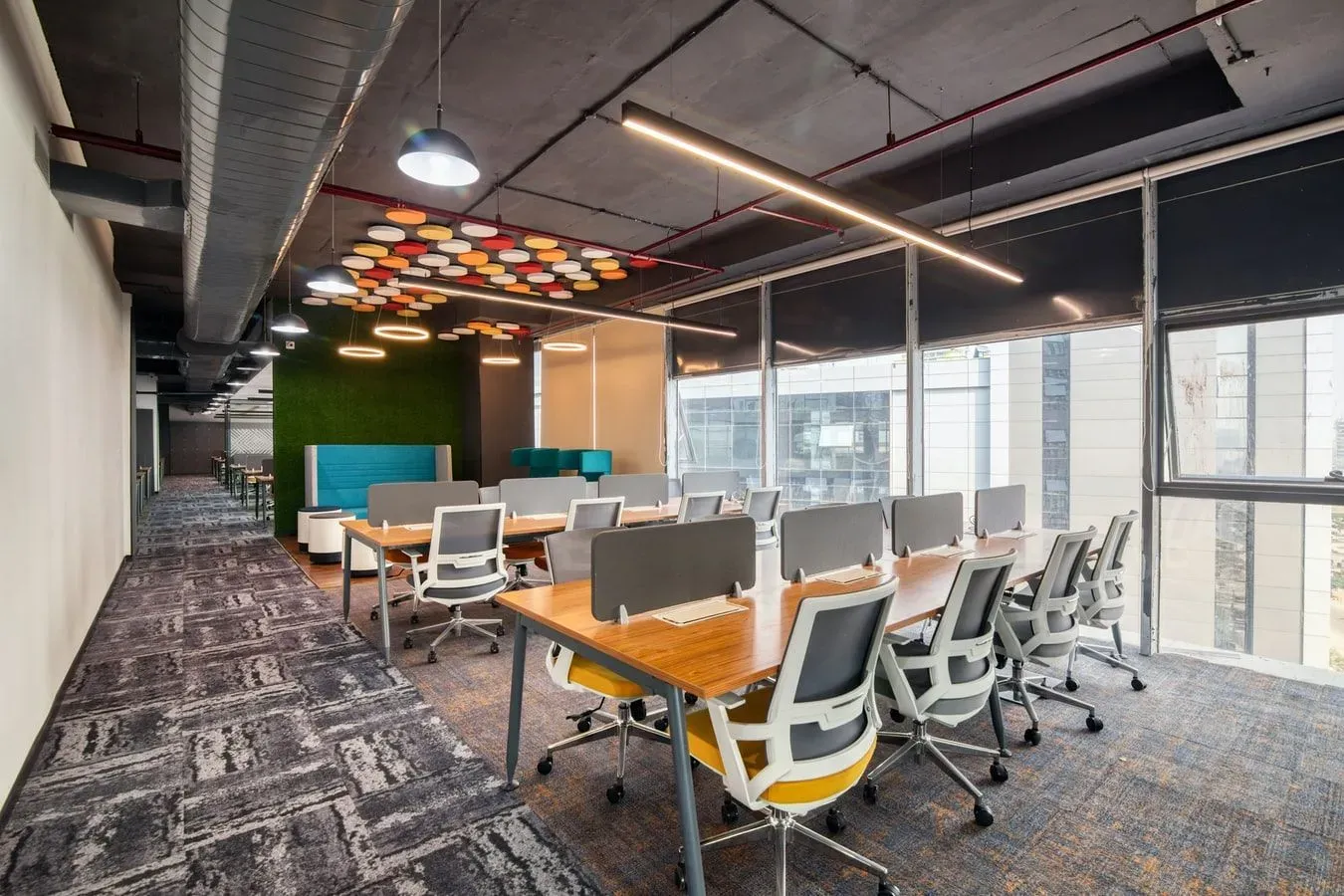 A large room with a lot of tables and chairs in it.