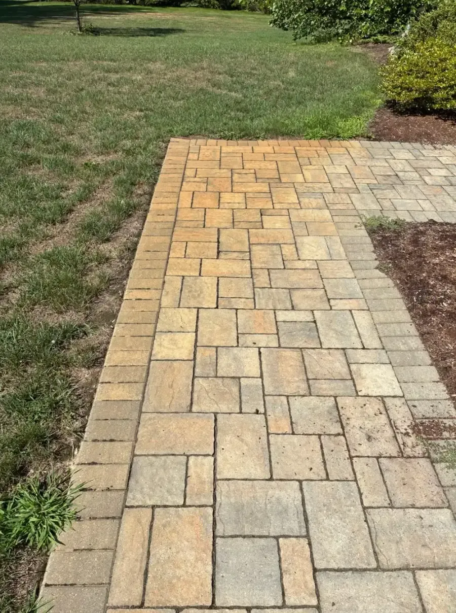 Before Irrigation Rust Stain Removal from a Paver Walkway in Worcester County, MA — Pro Pressure Washing