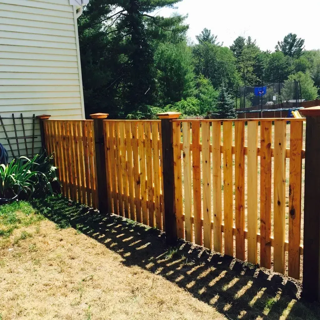 Cedar wood fence in a residential backyard