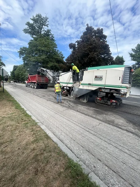 Road milling operations by Walsh Contracting Corp, restoring the asphalt surface in preparation for high-quality pavement installation.