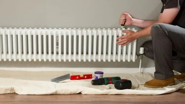 Technician repairing radiator