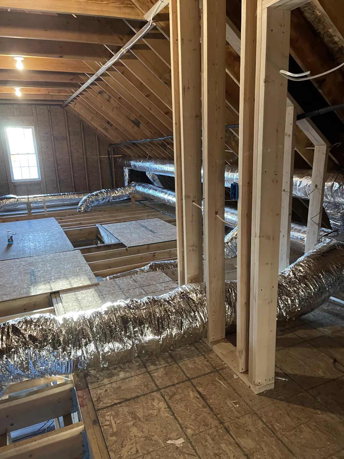 All-new insulated ductwork run through an attic