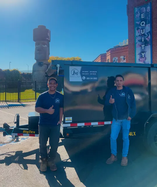 Khaz and Hiram beside the JM Hauling Big Tex dump trailer