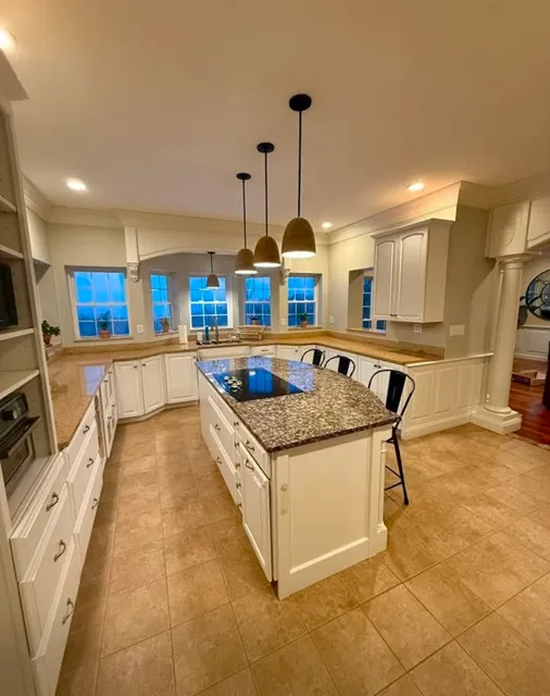 Repainted kitchen with white cabinetry and trim in Mason, New Hampshire