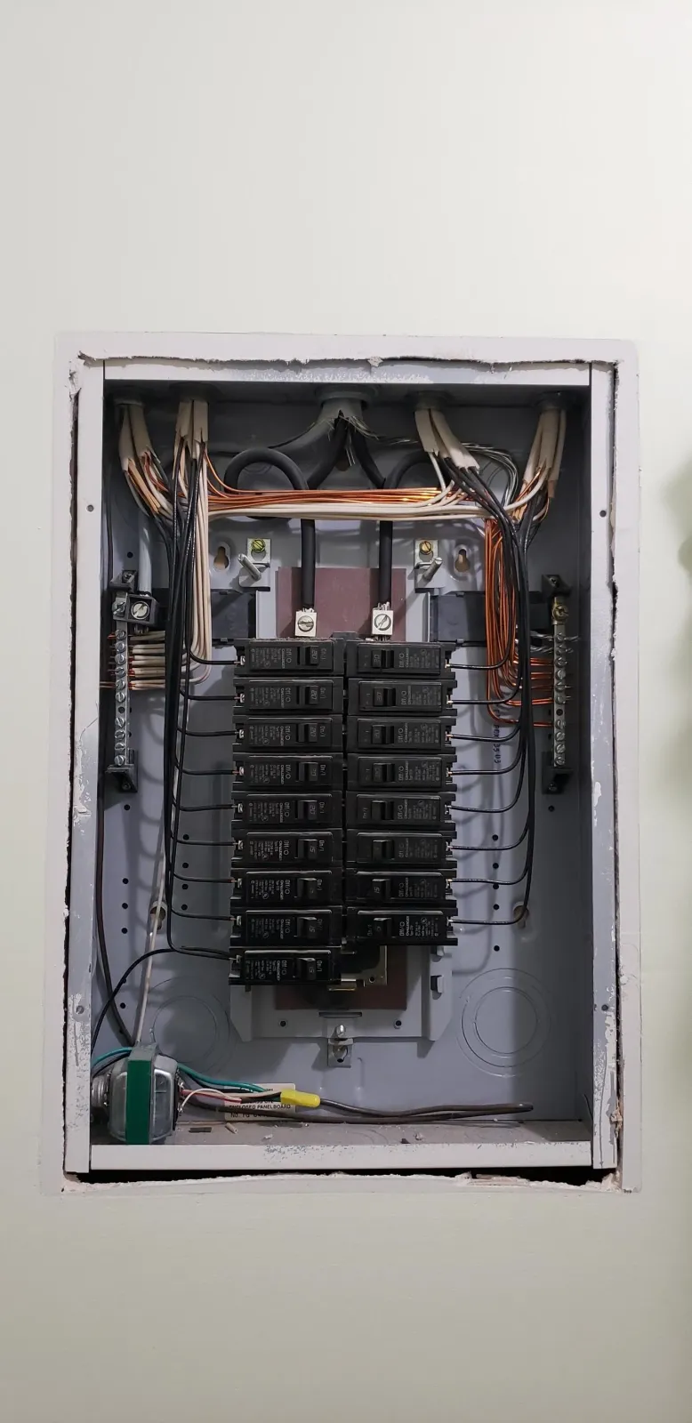 A close up of an electrical box on a wall.