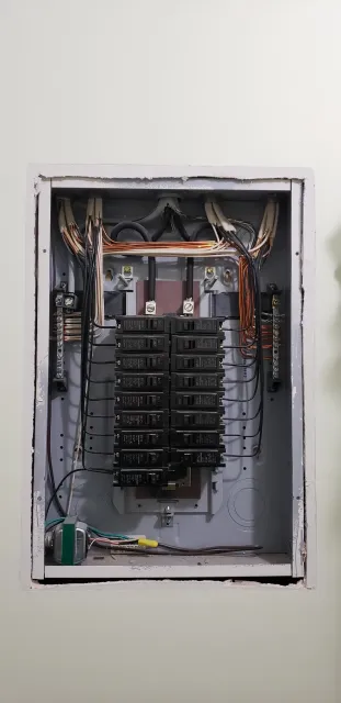 A close up of an electrical box on a wall.