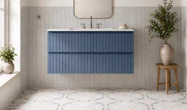 Modern bathroom vanity with white countertop, blue floating cabinet, and light tile walls