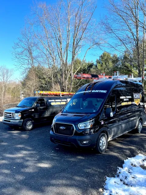 Two McCormack Electric Vans in a driveway