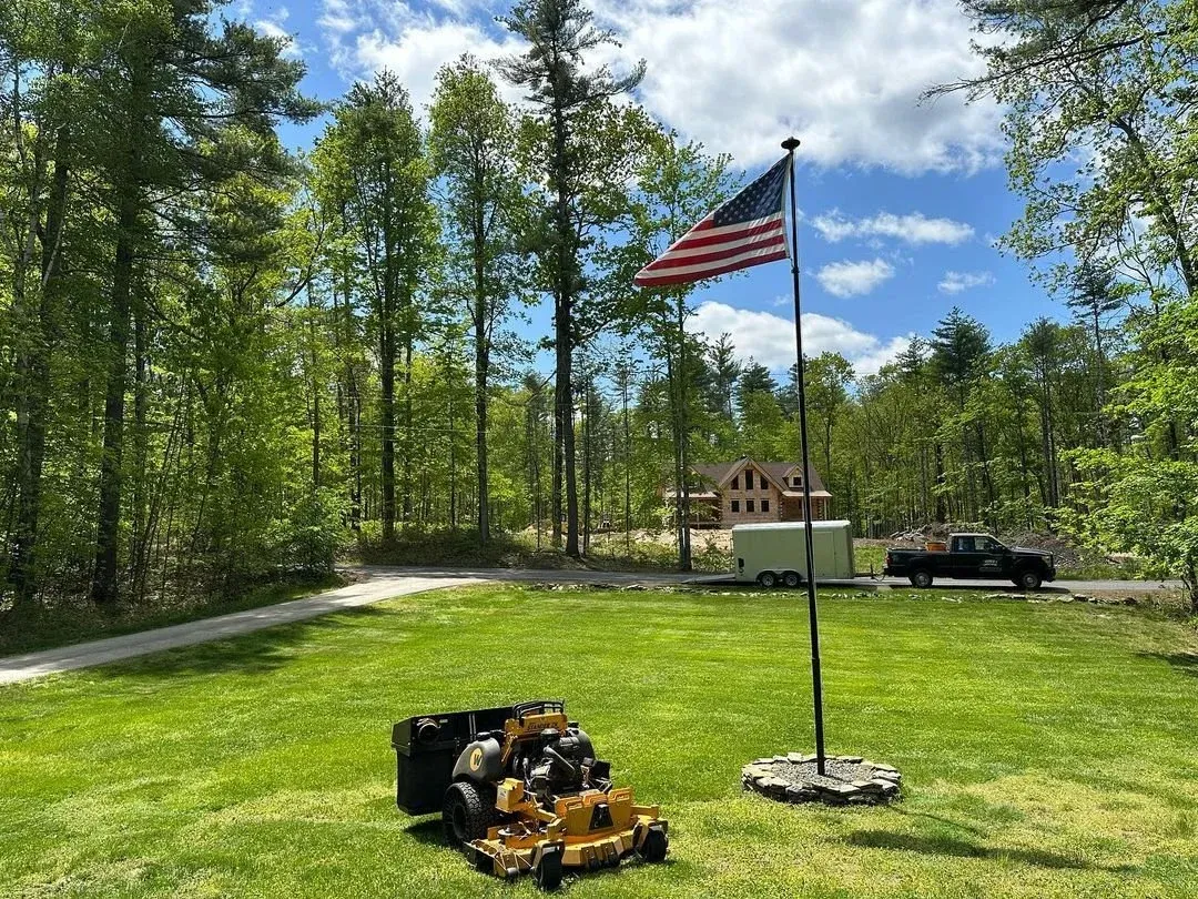 Front yard lawn mowing in Groton, MA by Gardner's Landscaping, LLC