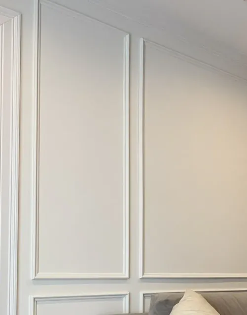Mitered corner of wall panel millwork