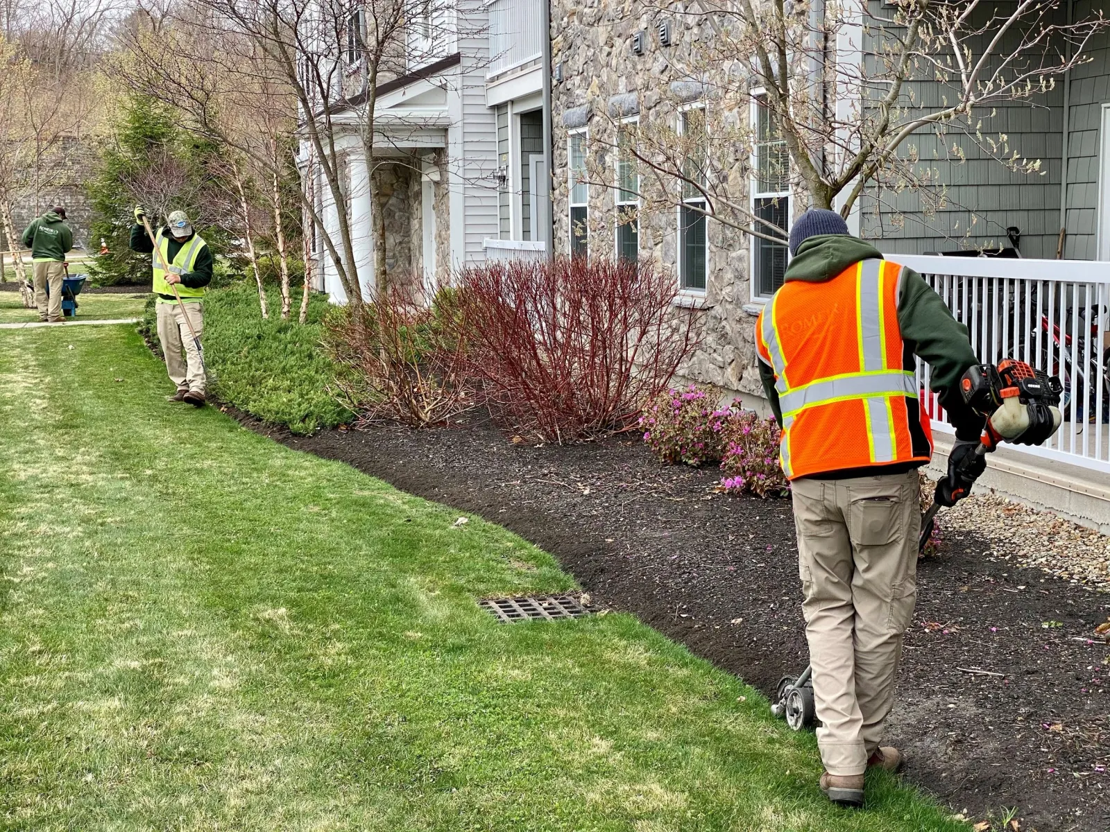 Romeiro's Landscape Maintenance crew providing expert property maintenance at a local housing community. Custom Landscape Maintenance South Shore.