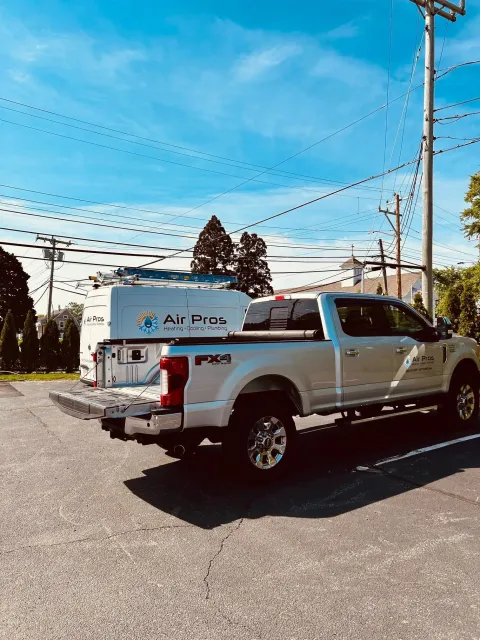Silver pickup truck with open tailgate and attached