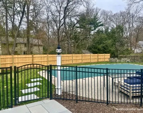 Aluminum fence around pool in MetroWest Massachusetts
