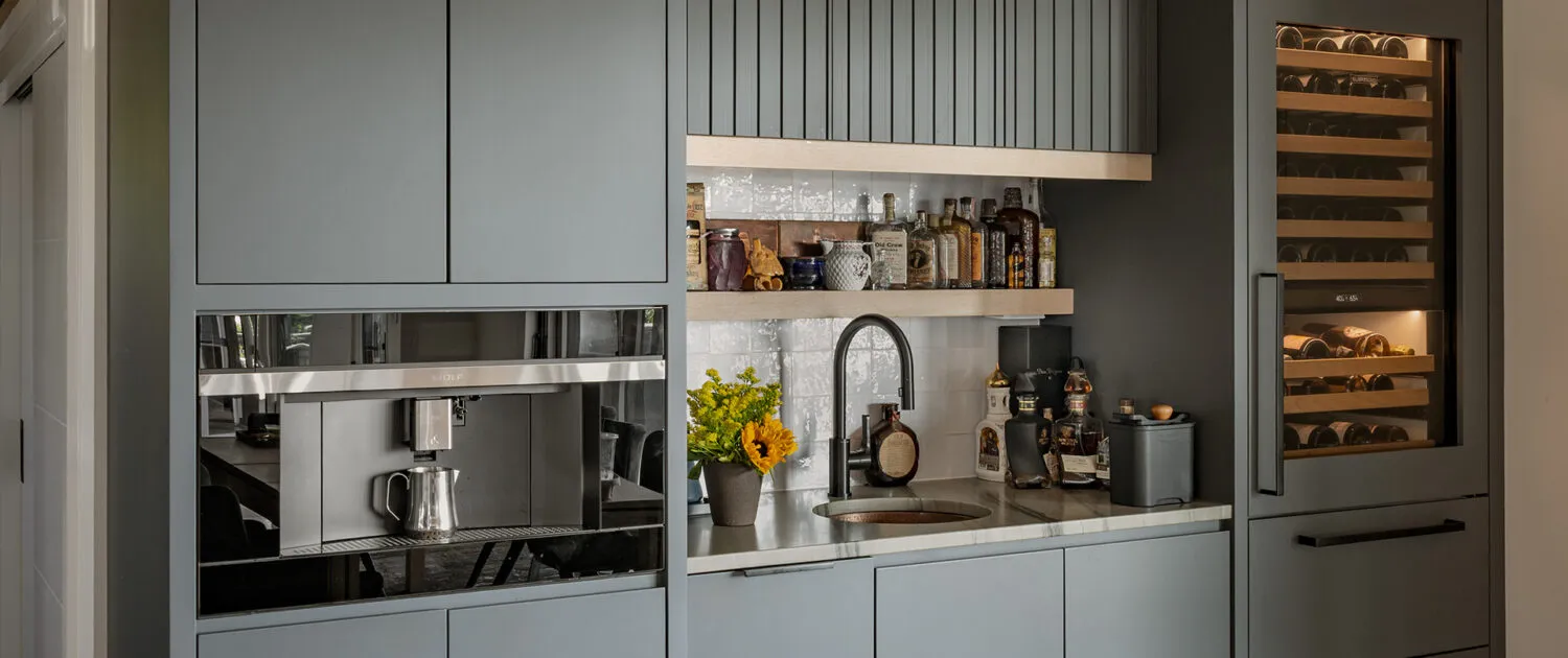 ARS Construction: Custom grey kitchen bar with wine fridge and coffee maker.