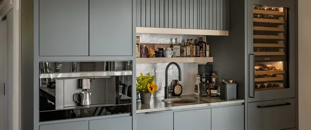 ARS Construction: Custom grey kitchen bar with wine fridge and coffee maker.